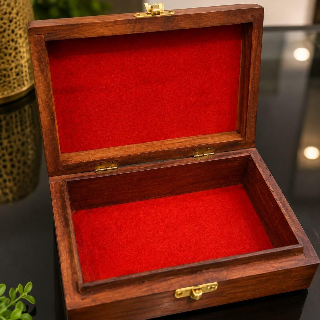 Handcrafted wooden jewellery box with floral hand carving, brass inlay design, and brass lock for storing jewellery and precious keepsakes.